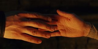 Kylo and Rey touching hands in The Last Jedi