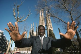 Former Cameroon and Espanyol goalkeeper Thomas N'Kono pictured in Barcelona in front of the Sagrada Familia in 1990.