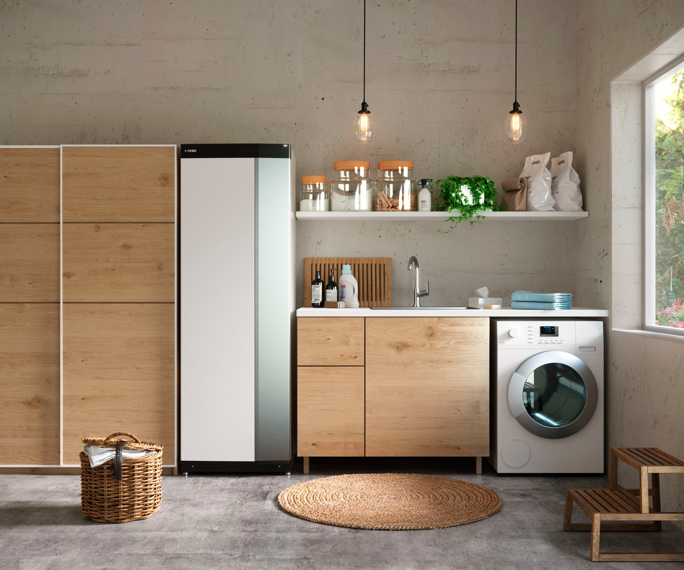 ground source heat pump unit in modern utility room next to storage cabinets, sink and washing machine
