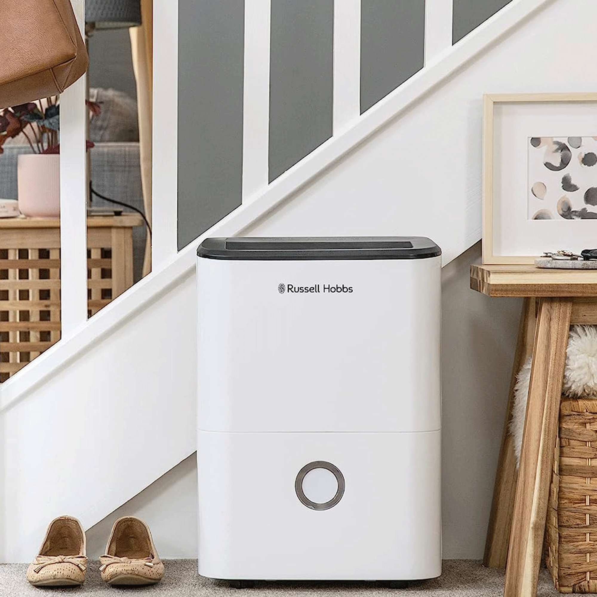 The Russell Hobbs 20 litre dehumidifier in hallway of an open plan living area