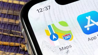 Apple maps logo on iPhone screen