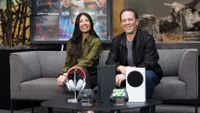Asha Sharma and Phil Spencer seated together