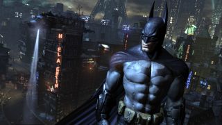 Best superhero games — Batman engages in some good old rooftop brooding over the walled subsection of Arkham City.