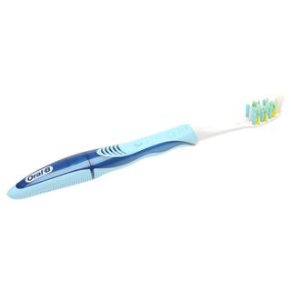 Blue Oral B soft toothbrush with blue, yellow and white bristles