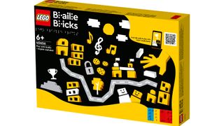 Lego Braille Bricks box - yellow with black and white images on it