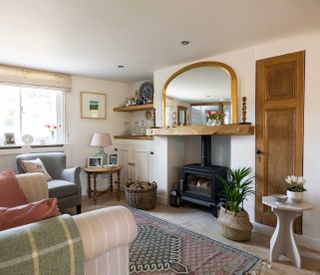 cottage style living room with woodburning stove