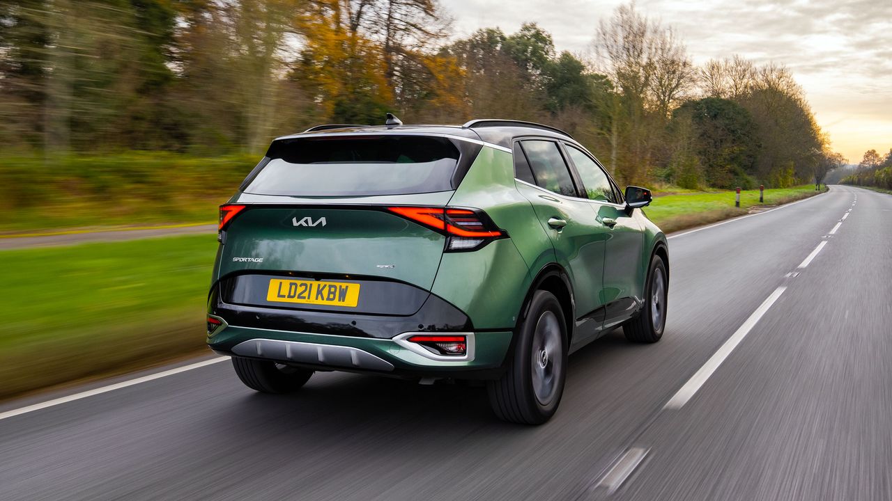 Kia Sportage driving on a road