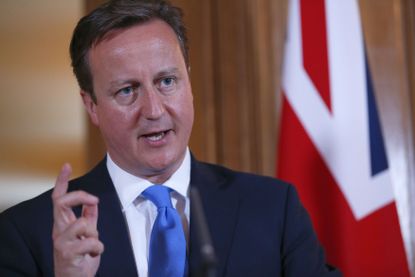 LONDON, UNITED KINGDOM - JULY 17:Britain's Prime Minister David Cameron answers a question during a joint news conference with Italy's Prime Minister Enrico Letta in 10 Downing Street on July