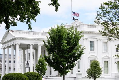 White House with flag at half-staff