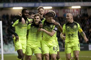 Ajer (back) joins in with the rest of his team-mates as they celebrate James Forrest's opener at Easter Road