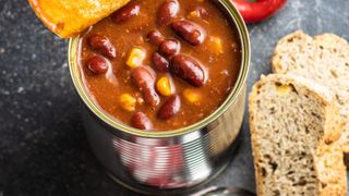 chilli con carne in a can next to bread