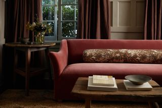 Pink velvet curved arm sofa, wooden side and coffee table