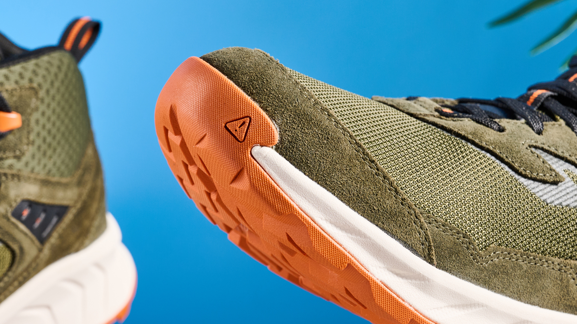 The Keen Hightrail Mid boots toe against a blue background