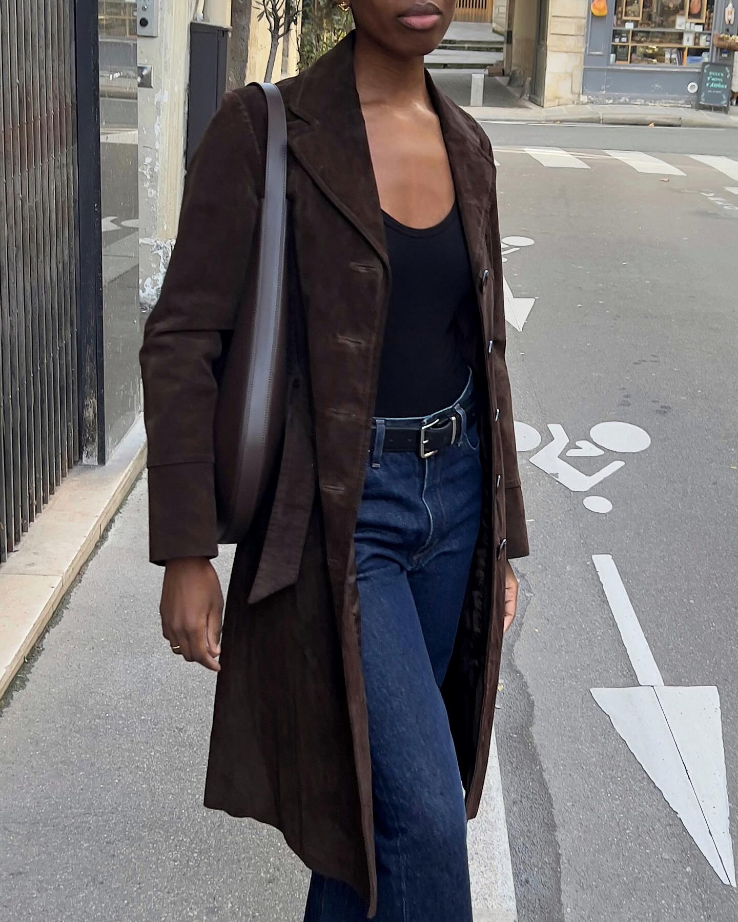 A woman in a suede jacket.