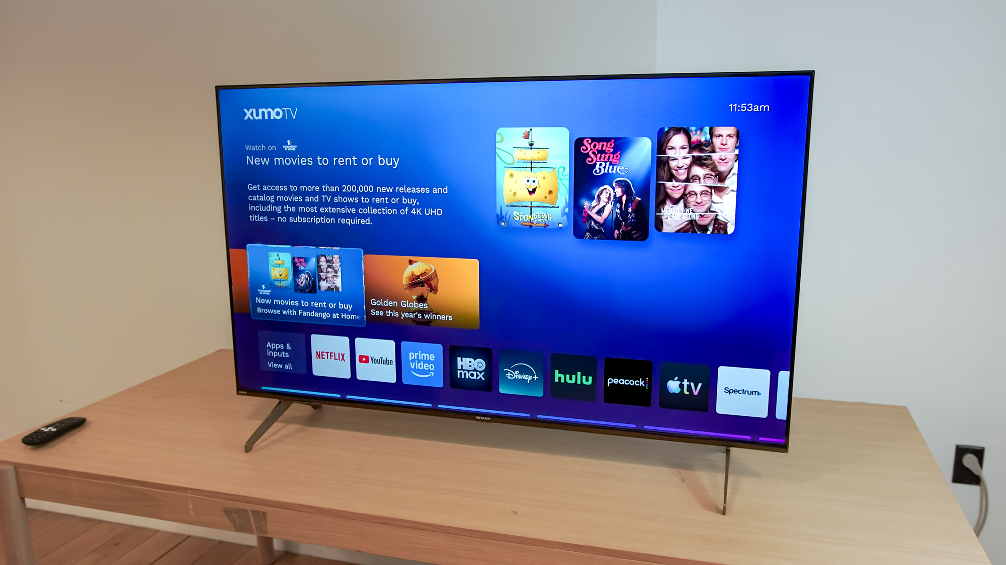 A Sharp Aquos QLED TV on a table