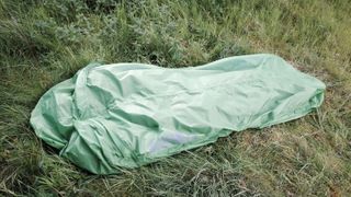 Alpkit Kloke bivy bag lying on grass