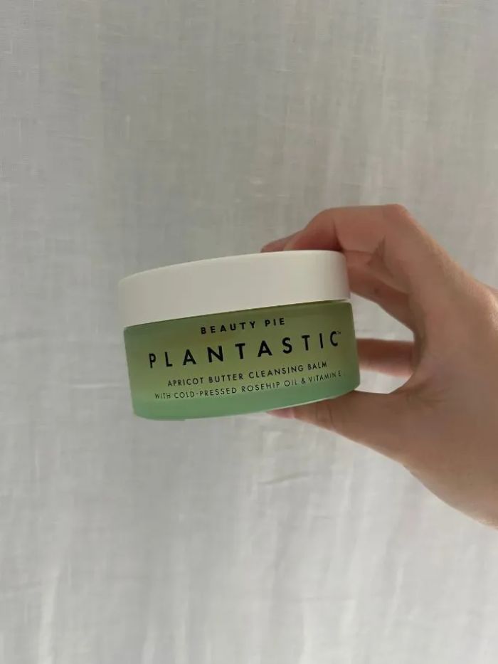 The Beauty Pie Plantastic Apricot Butter Cleansing Balm on a white linen background