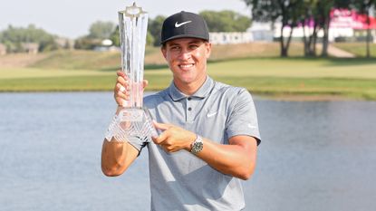 Cameron Champ poses with the trophy after winning the 2021 3M Open