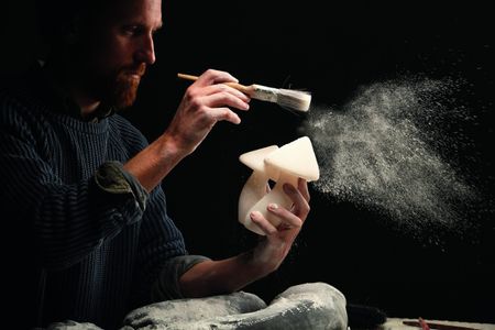 Sculptor Ben Russell works on one of his creations in his studio workshop set in the Dorset Sculptor Ben Russell works on one of his creations in his studio workshop set in Dorset