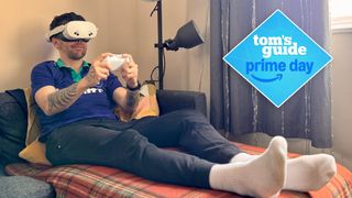 Meta Quest 3S on person lying on couch with controller in hand with Tom's Guide Prime Day badge