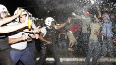 Police spray demonstrators with pepper gas during a student protest at National Congress in Brasilia, on June 20, 2013 within what is now called the 'Tropical Spring' against corruption and p
