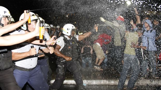 Police spray demonstrators with pepper gas during a student protest at National Congress in Brasilia, on June 20, 2013 within what is now called the &amp;#039;Tropical Spring&amp;#039; against corruption and p