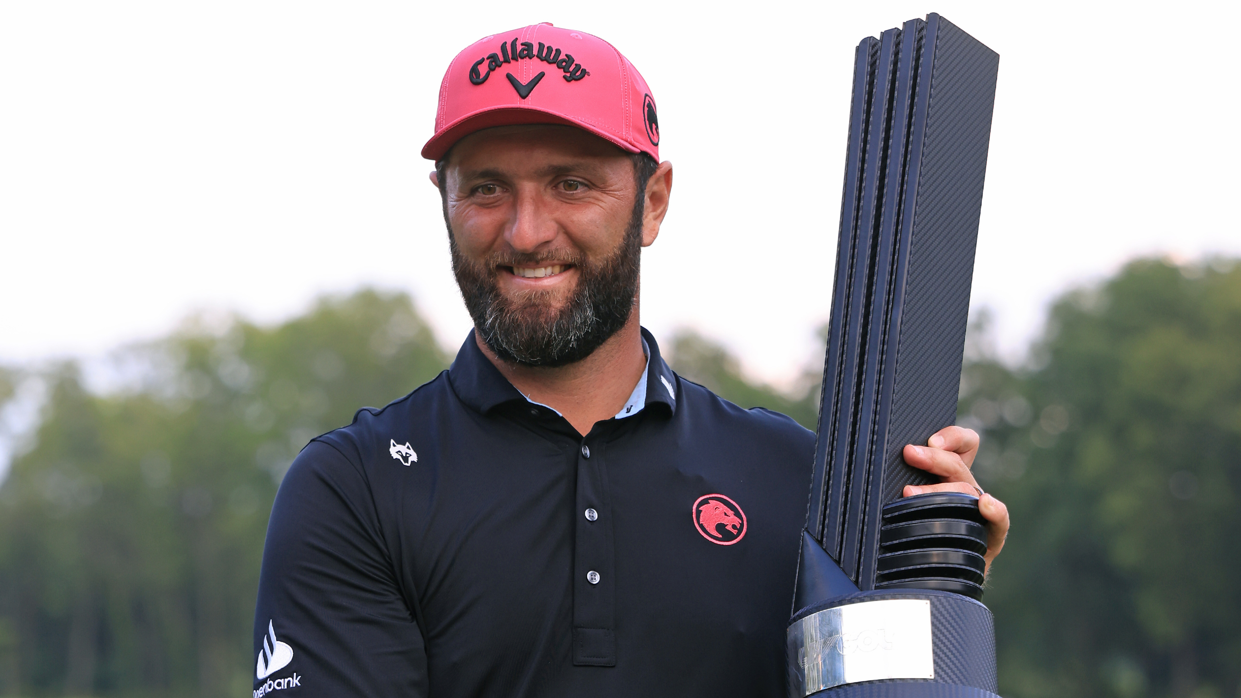 Jon Rahm holds the LIV Golf Individual Championship trophy