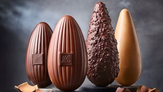 Four different kinds of chocolate Easter Egg on a grey background
