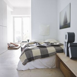 bedroom with double door and wooden flooring