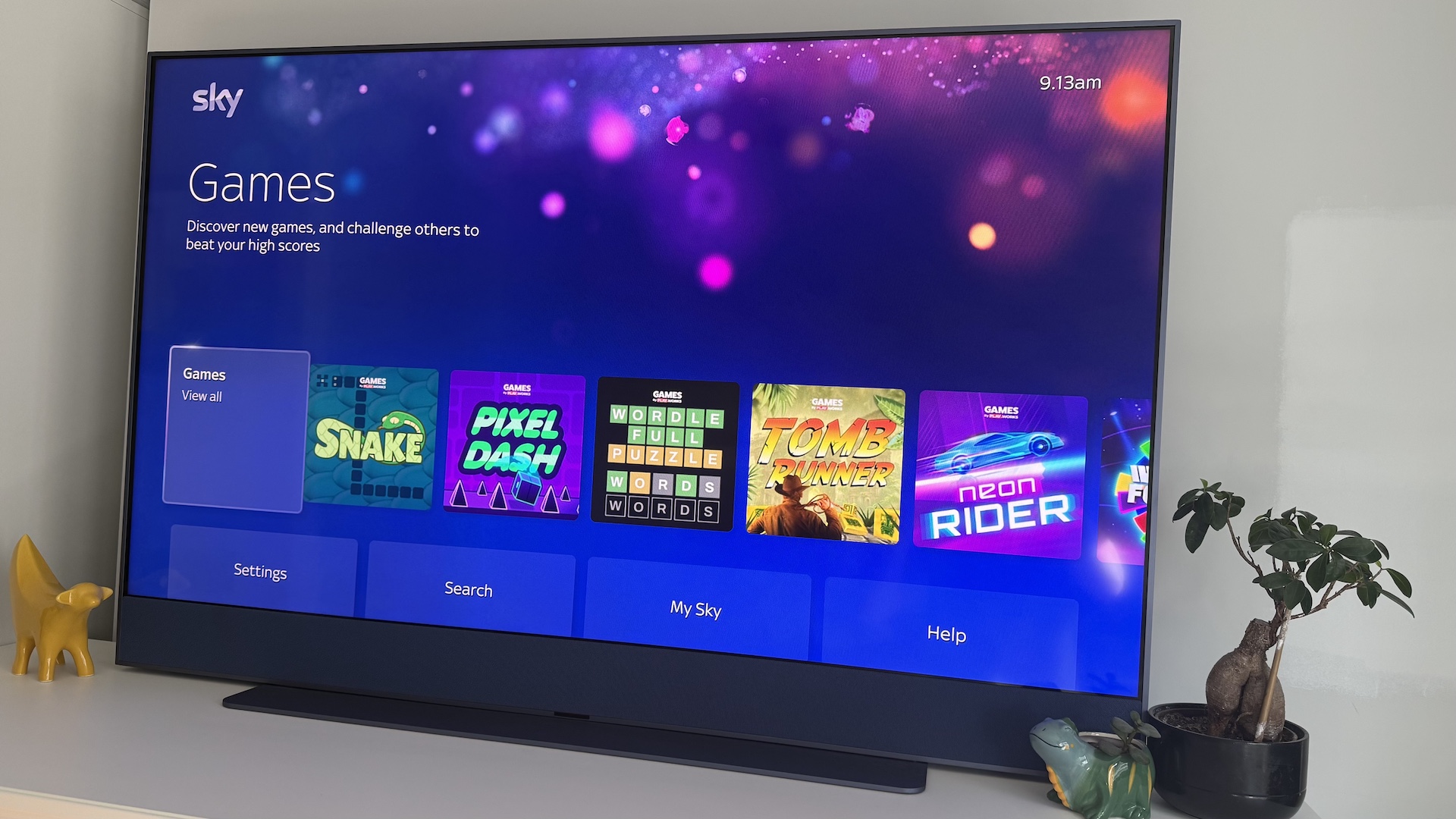 The Sky Glass Gen 2 screen on a white cabinet