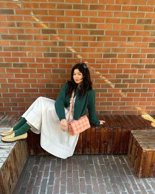 @alllisonho wearing a cardigan, dress and loafers
