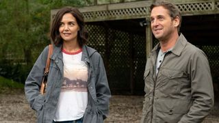 Katie Holmes and Josh Lucas stand next to each other in The Secret Dare to Dream