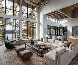 lakeside cabin living room with steel framed windows white walls