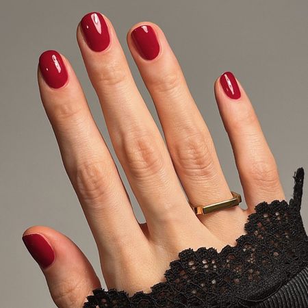 A picture of a short, oval-shaped manicure with the Essie Bubbles Only nail polish