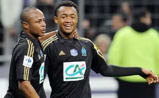 Andre and Jordan Ayew celebrate a goal for Marseille in 2012.