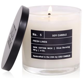 White fresh linen candle with black label