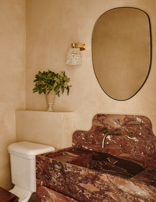 A micro cement bathroom with marble basin