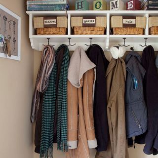 utility room with cloths hangers and shelves