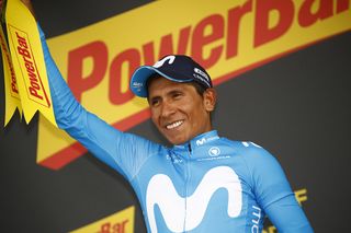 Nairo Quintana (Movistar) waves to the crowd on the podium at the top of the Geraint Thomas (Sky) finishes third on the Col du Portet