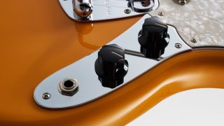 Close up of a Fender Mustang control plate