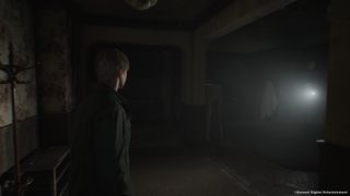 James explores an abandoned apartment in Silent Hill 2.