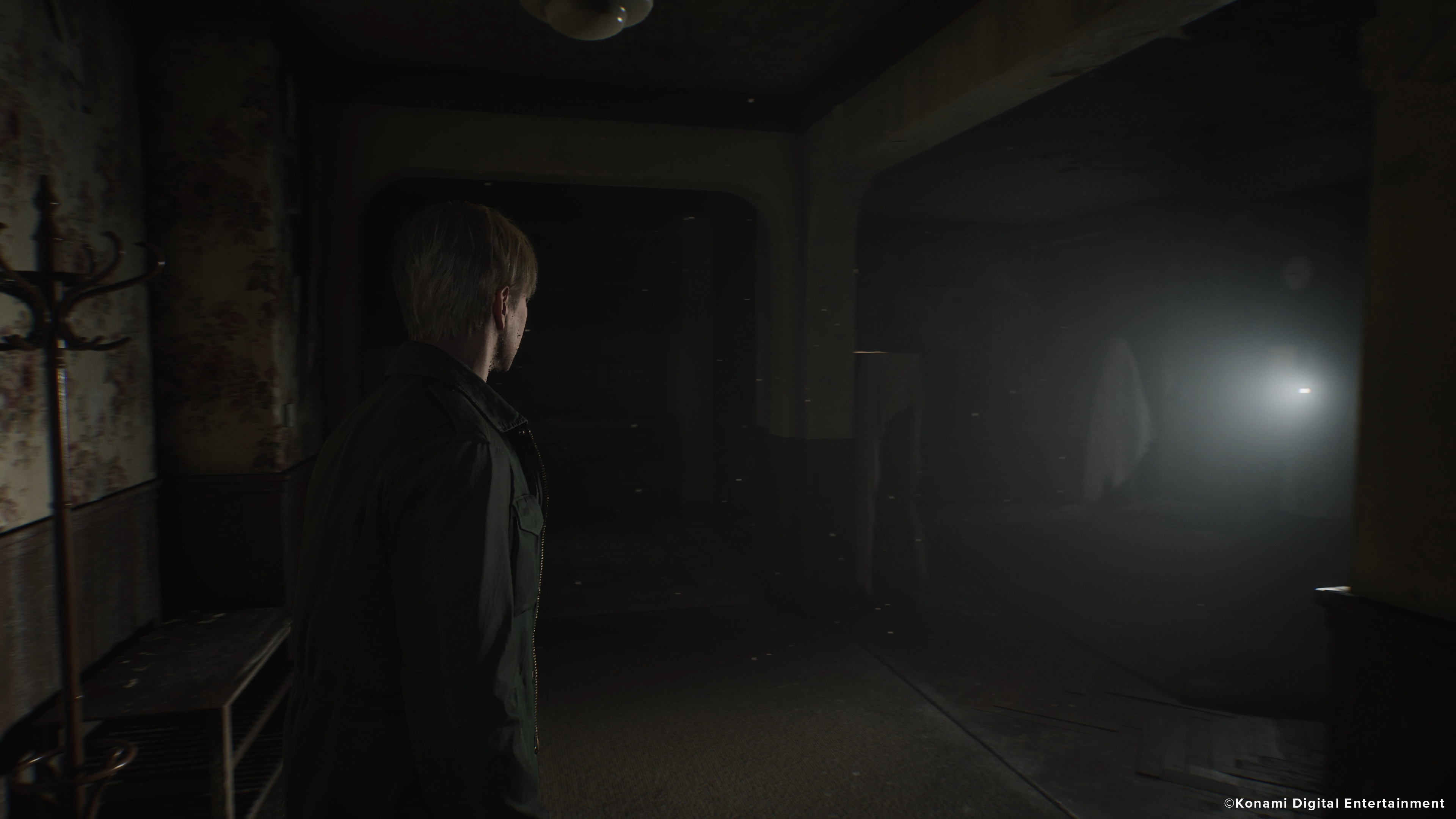 James explores an abandoned apartment in Silent Hill 2.