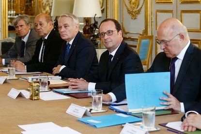 French President Francois Hollande and several French ministers.