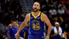 Golden State Warriors Stephen Curry celebrates scoring a three-point basket