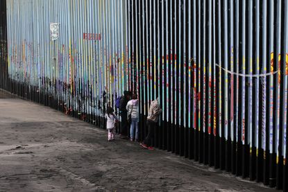 A family at the U.S.-Mexico border.