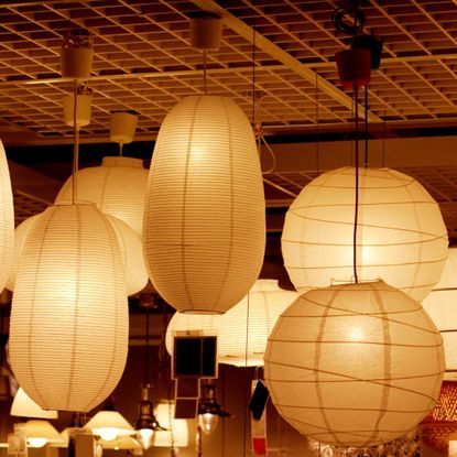 Assortment of paper lamps hanging from the ceiling