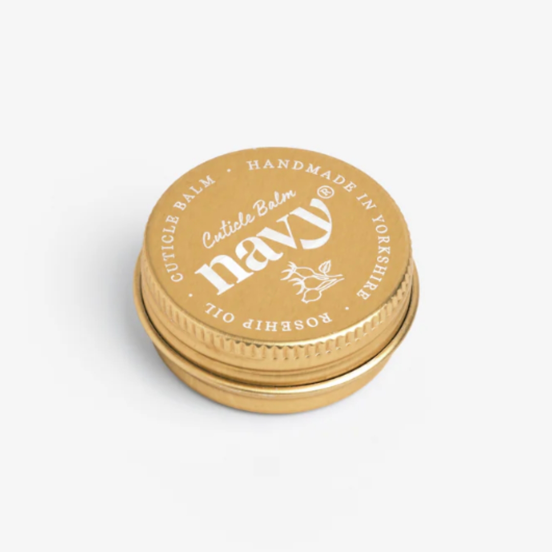 A product shot of the Navy® Cuticle Balm, on a grey background
