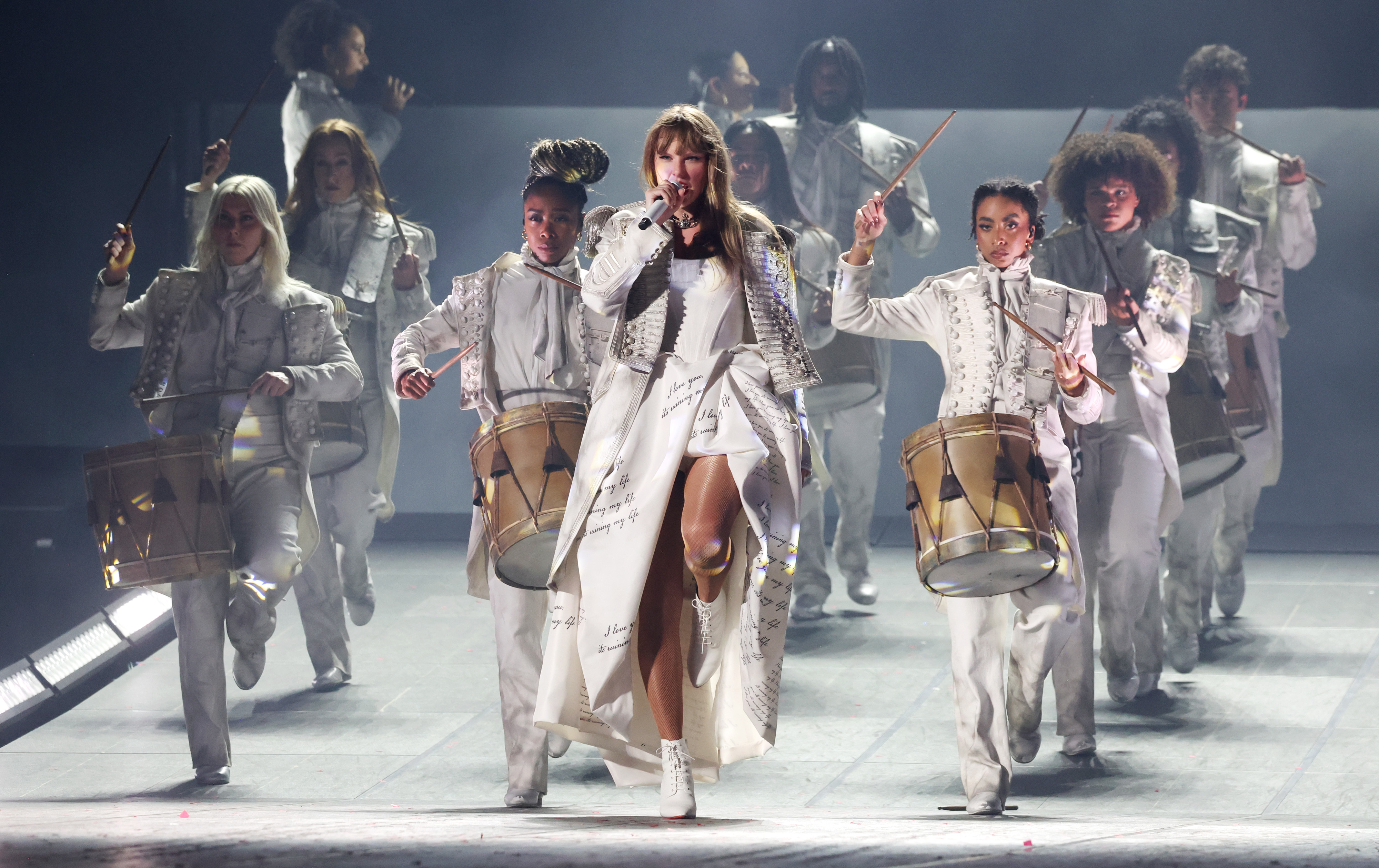 taylor swift new eras tour outfits paris may 2024 european leg wearing a white dress, white coat, and white ankle boots