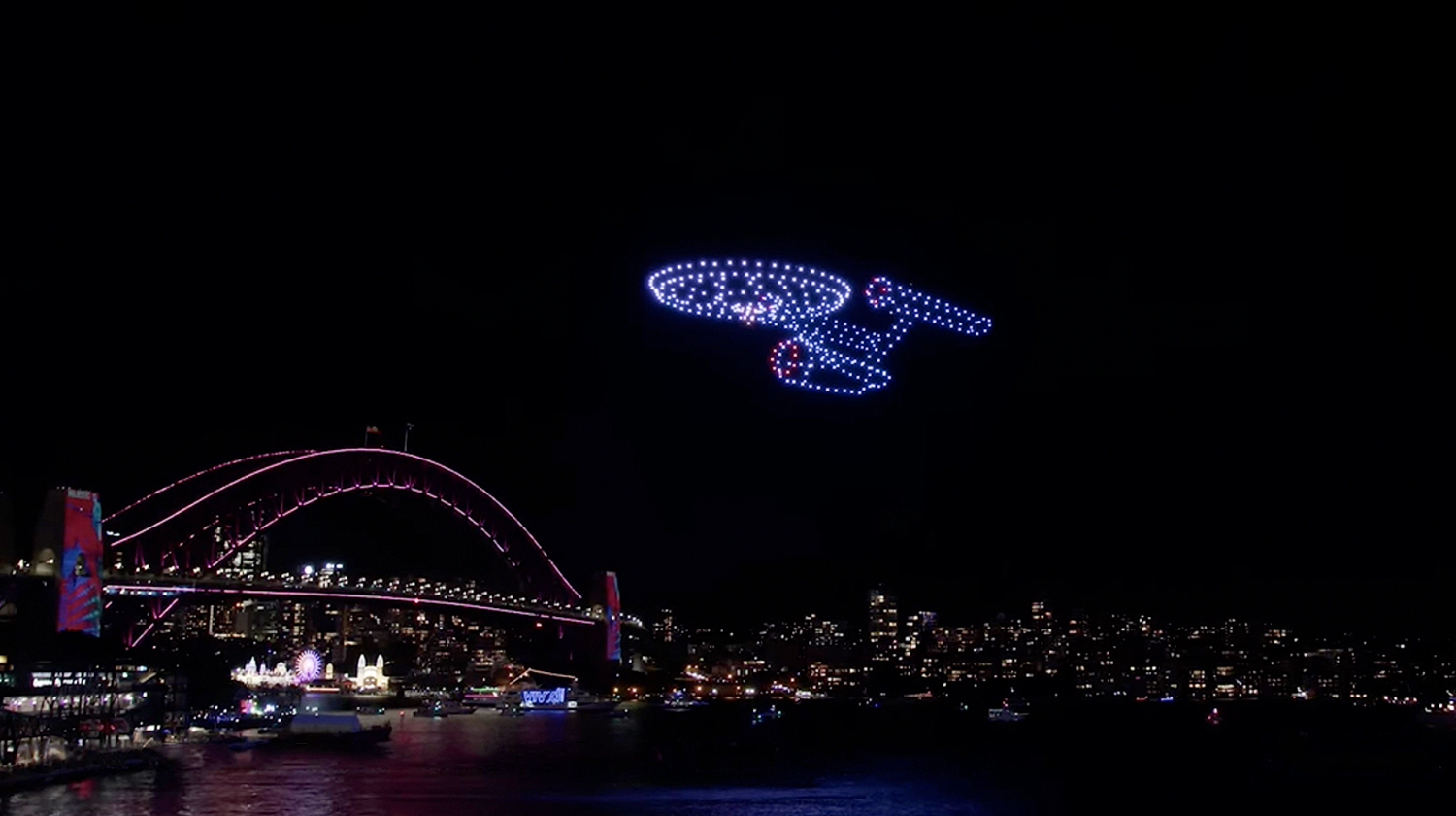 The starship USS Enterprise in drones light up the sky above Australia.