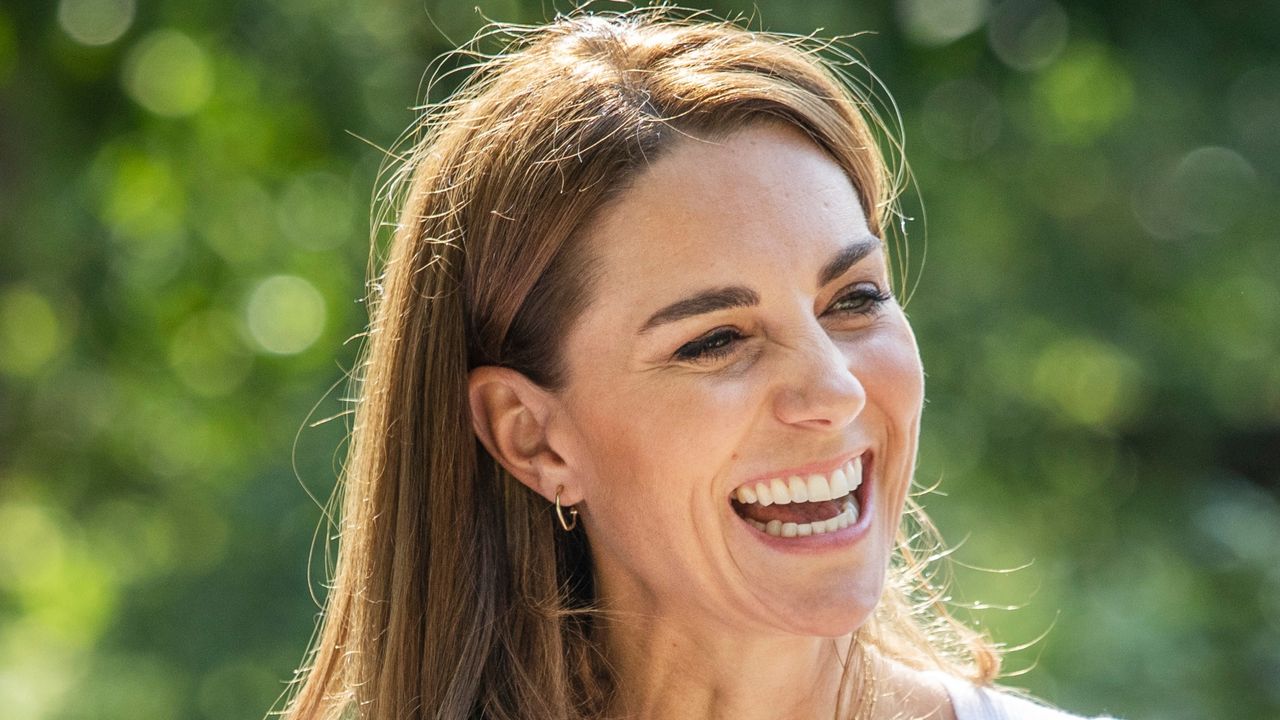 Kate’s practical raincoat and £60 hoops wow in Wales. Seen here Catherine, Princess of Wales hears from families and key organisations